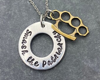 Hand stamped "Smash the Patriarchy” necklace.