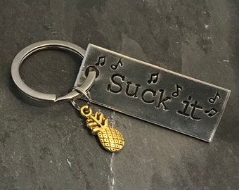 Hand stamped "Suck it” Psych inspired keychain with pineapple charm