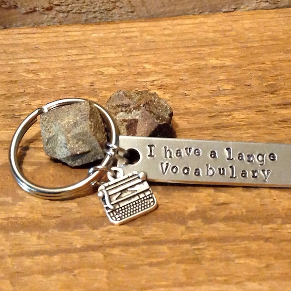 Hand stamped keychain, "I have a large vocabulary" with typewriter charm