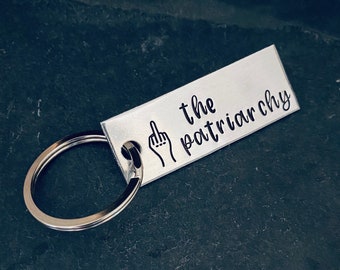 Hand stamped "F the patriarchy” RBG quote keychain.