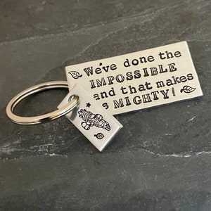 Hand stamped "We've done the impossible and that makes us mighty" Firefly inspired keychain with stamped Serenity charm
