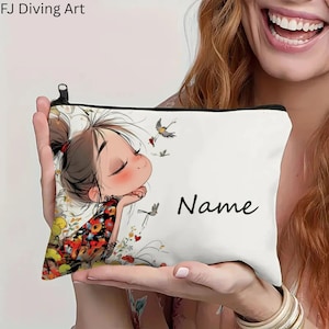 May include: White zipped pouch with a cartoon illustration of a girl with closed eyes, surrounded by birds and flowers. The pouch has the word "Name" printed in black. The top left corner has the text "FJ Diving Art".