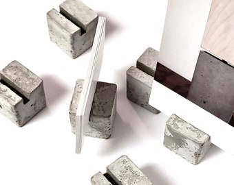 concrete blocks. set of 10 of the original business card stand. vertical or horizontal picture displays and postcard holders.