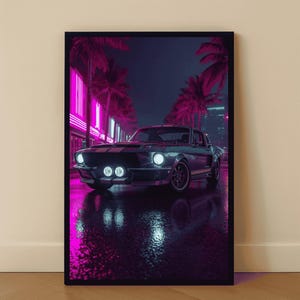 May include: A framed print of a classic black sports car driving down a neon-lit street at night. The artwork features a retro aesthetic with pink and purple hues, palm trees, and reflections on the wet pavement.