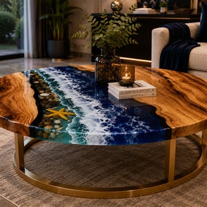 May include: A round coffee table featuring a natural wood edge and a central resin inlay depicting an ocean scene with white waves, turquoise and deep blue water, embedded pebbles, and a yellow starfish, supported by a gold metal circular base.