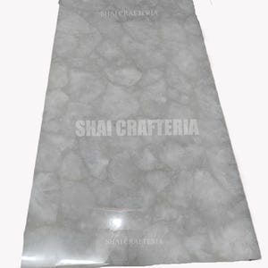 Elegant white quartz dining table with modern design luxurious surface for living room furniture perfect for home interior