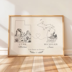 May include: A framed print featuring outlines of Utah and Michigan connected by a dotted heart line. Utah shows a desert arch, while Michigan displays a lighthouse and trees. Text includes Utah, Matthew, Michigan, Jenna, and Love knows no distance.
