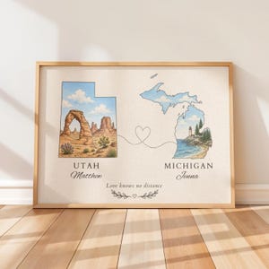 May include: A framed wall art print featuring a map of Utah with a desert landscape and a map of Michigan with a lighthouse. A dotted line with a heart connects the two states. The text reads Utah, Matthew, Michigan, Jenna, and Love knows no distance.