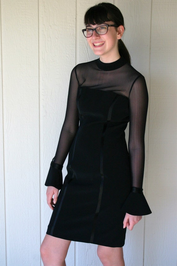 black cocktail dress with sheer sleeves