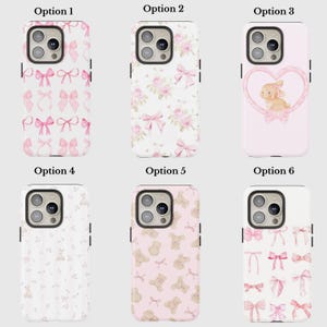 May include: A collection of six phone cases with various designs. Options include pink bows, floral patterns, a bunny in a heart, teddy bears, and more bows. Each case has a camera cutout and black side accents.