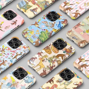 May include: A selection of phone cases adorned with vibrant illustrations of a monkey in diverse settings. The cases display a range of colours, such as pink, blue, and cream, with detailed artwork of the monkey interacting with various objects and environments.