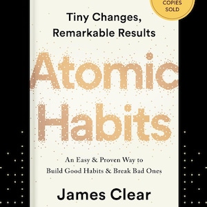 May include: A book cover with the title "Atomic Habits" in large, dotted orange letters. The book is titled "Tiny Changes, Remarkable Results" and is written by James Clear. A gold sticker indicates over 25 million copies sold.