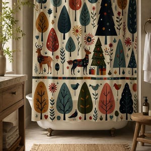 May include: A cream-colored shower curtain featuring a repeating pattern of stylized trees, deer, birds, and flowers in shades of red, blue, green, and orange. The design includes geometric shapes and small gift boxes beneath a large dark tree.
