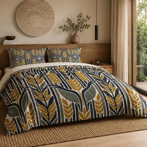 May include: A bedding set featuring a duvet cover and two matching pillowcases with a repeating pattern of stylized wheat stalks in mustard yellow, dark navy blue, and sage green against a white background with vertical navy blue stripes.