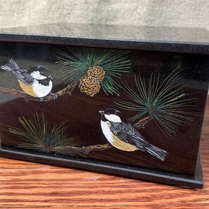 Companion cremation urn. Absolute black granite chickadee companion urn