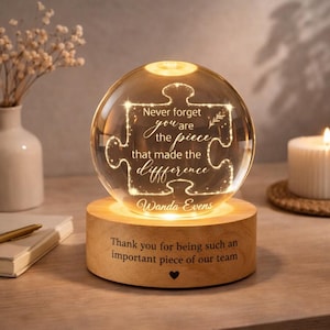 May include: A set of three ceramic mugs with a speckled, matte finish. The mugs are in shades of cream, light gray, and dark gray. Each mug has a simple, minimalist design and a rounded handle.