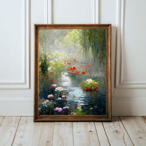 May include: A framed painting of a serene waterscape with a variety of colorful flowers, including red poppies and white blossoms, lining the water's edge. The artwork is set in a wooden frame and evokes a sense of tranquility.
