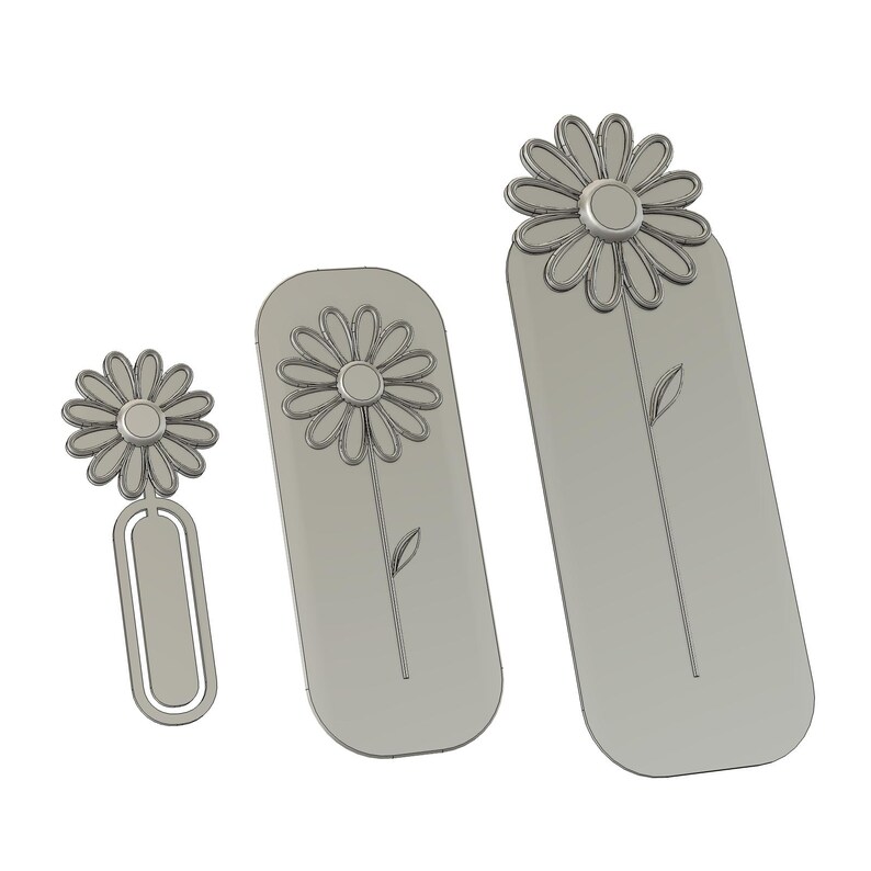 May include: Three light grey bookmarks of varying sizes, each featuring a raised daisy flower design at the top. The smallest bookmark has a paperclip-style base, while the two larger bookmarks are rectangular with rounded edges and a stem.
