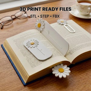May include: Three white and yellow daisy-themed bookmarks placed on an open book. One bookmark is a flat rectangular tab with a daisy, another is a clip-style bookmark, and the third is a daisy-shaped page marker. Text reads 3D PRINT READY FILES STL STEP FBX.