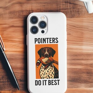 May include: White phone case featuring a graphic of a hunting dog with a pheasant in its mouth, set against an orange background. The text "POINTERS DO IT BEST" is displayed above and below the graphic.