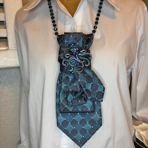Upcycled necktie transformed into one of a kind necklace with broach
