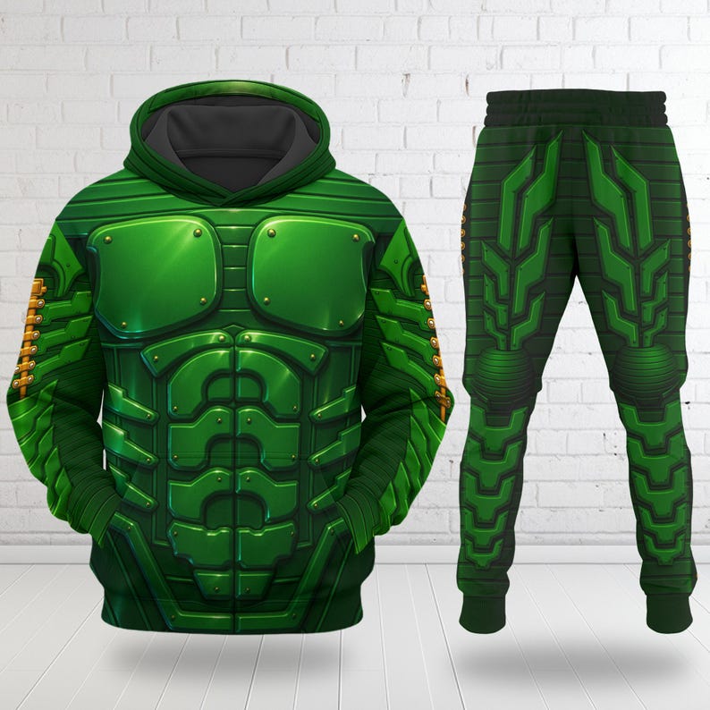 May include: A green hooded sweatshirt and matching sweatpants set featuring a printed graphic design of segmented armor plating with metallic rivets and a muscular chest plate pattern, complete with a dark gray hood lining and ribbed cuffs.