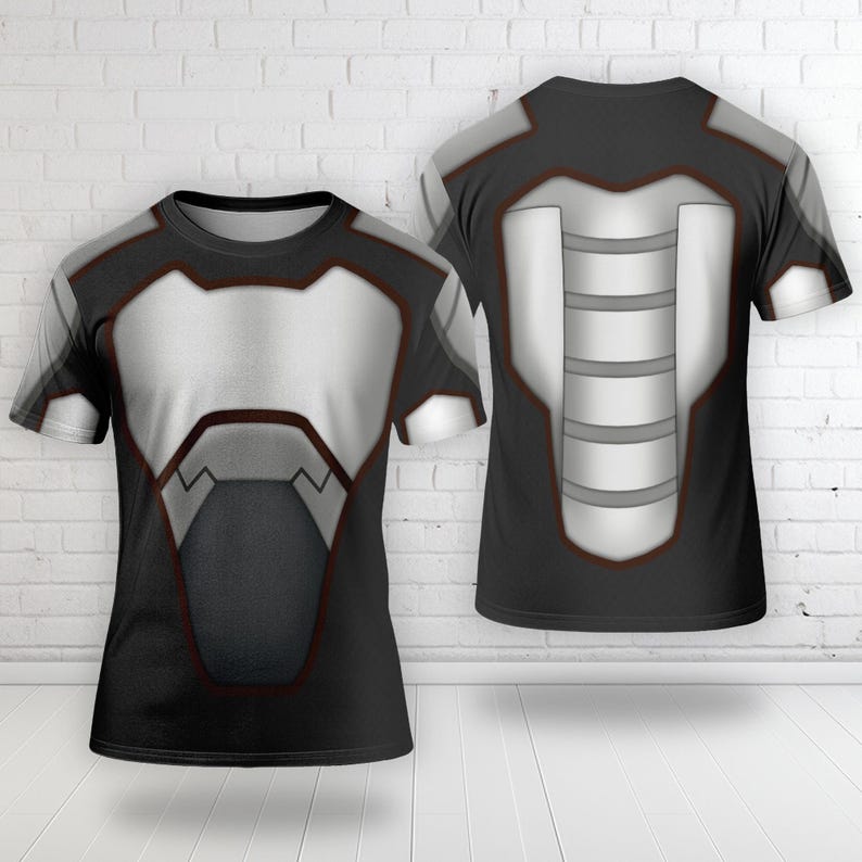 May include: A short-sleeved t-shirt featuring a graphic print of futuristic armor. The design includes black and silver-grey panels with dark red outlines, mimicking a chest plate on the front and a segmented spinal guard on the back view.