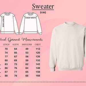 May include: A plain light beige crewneck sweater shown alongside a sizing chart with technical line drawings. The chart displays measurements in centimeters for sizes S through 5XL, detailing body length, sleeve, shoulder, and chest dimensions.