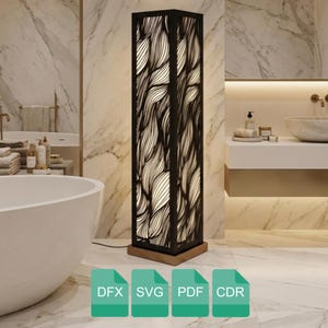 Könnte beinhalten: Eine hohe, rechteckige schwarze Stehlampe mit einem dekorativen, wellenartigen Muster. Die Lampe hat einen Holzsockel und wird von innen beleuchtet, wodurch ein warmes Leuchten entsteht. Die Lampe befindet sich in einem Badezimmer. Der untere Teil des Bildes enthält den Text: DFX, SVG, PDF, CDR.
