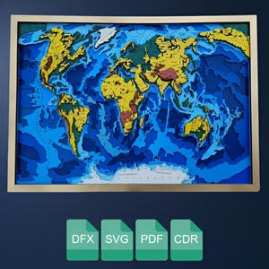 May include: A framed, layered wooden world map with a gold frame. The continents are in shades of yellow, brown, and red, set against a blue ocean. The map includes depth contours, creating a 3D effect. The bottom of the image shows file type icons: DFX, SVG, PDF, and CDR.