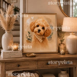 May include: A framed print of a golden-colored puppy wearing a checkered bandana is displayed on a wooden console table. The table is adorned with decorative items, including books, candles, and a vase with dried pampas grass. A mirror and lamp are also visible.