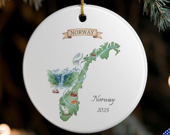 May include: White ceramic Christmas ornament with a map of Norway in green and brown, featuring illustrations of landmarks. The word "Norway" is printed above the map, and "Norway 2025" is printed below. A gold string is attached for hanging.