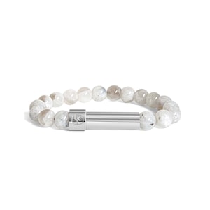 May include: A bracelet with light grey and white speckled beads. It has a silver-coloured, cylindrical clasp with a square design. The round beads appear to be made of stone. The bracelet is a piece of jewellery.