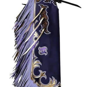 May include: A navy blue leather chaps with intricate gold and brown decorative accents. The chaps feature a light purple fringe along the sides and bottom. The design includes gold filigree and a purple emblem.