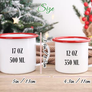 May include: Two white enamel mugs with red rims and handles. The larger mug is 5 inches wide and 3.4 inches tall, holding 17 oz or 500 ml. The smaller mug is 4.3 inches wide and 3 inches tall, holding 12 oz or 350 ml.
