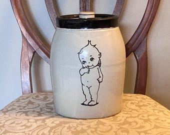 Darling old crockery cookie jar with Kewpie Baby doll image