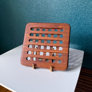 May include: A set of three ceramic mugs with a speckled, matte finish. The mugs are in shades of cream, light gray, and dark gray. Each mug has a simple, minimalist design and a rounded handle. The mugs are stacked on top of each other.