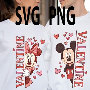 May include: White sweatshirts featuring Minnie Mouse and Mickey Mouse designs with the word "VALENTINE" in red. The Minnie Mouse design includes a red bow and hearts. The Mickey Mouse design has red shorts and hearts.
