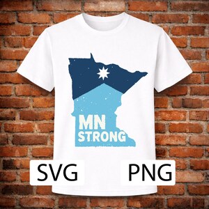 May include: White t-shirt featuring a blue and light blue graphic of the state of Minnesota with a star and the text "MN STRONG". The shirt also has the text "SVG" and "PNG" at the bottom.
