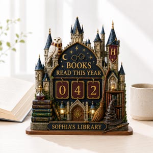 May include: A decorative castle-themed book tracker featuring a white owl, a broomstick, and a stack of books labeled Potions, Charms, Transfiguration, Herbology, and Defence Against the Dark Arts. The display reads BOOKS READ THIS YEAR 042 and SOPHIA'S LIBRARY.
