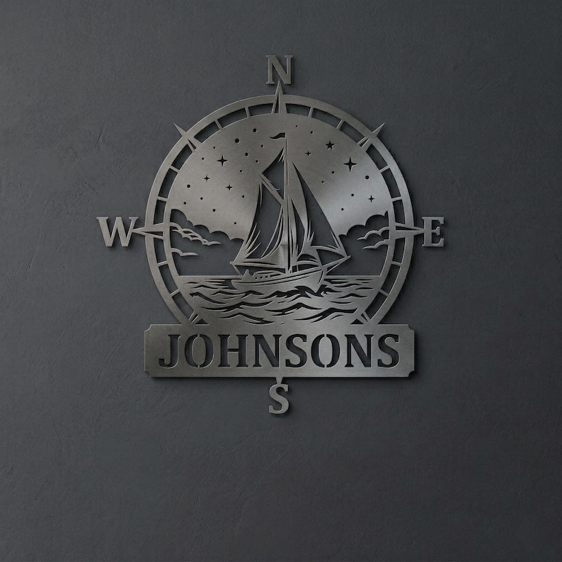 Personalized nautical compass metal wall decor featuring a sailboat at sea with custom family name, designed in a round coastal style. Available in multiple sizes and finishes including black, gold, silver, bronze, and white. Ideal for living rooms, entryways, beach houses, lake houses, or outdoor walls. Easy to hang and weather resistant. A unique gift for sailors, ocean lovers, housewarming, weddings, or modern coastal home decor.