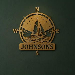 Personalized nautical compass metal wall decor featuring a sailboat at sea with custom family name, designed in a round coastal style. Available in multiple sizes and finishes including black, gold, silver, bronze, and white. Ideal for living rooms, entryways, beach houses, lake houses, or outdoor walls. Easy to hang and weather resistant. A unique gift for sailors, ocean lovers, housewarming, weddings, or modern coastal home decor.