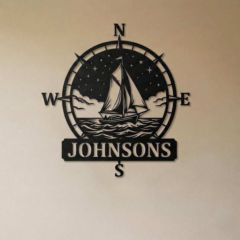 Personalized nautical compass metal wall decor featuring a sailboat at sea with custom family name, designed in a round coastal style. Available in multiple sizes and finishes including black, gold, silver, bronze, and white. Ideal for living rooms, entryways, beach houses, lake houses, or outdoor walls. Easy to hang and weather resistant. A unique gift for sailors, ocean lovers, housewarming, weddings, or modern coastal home decor.