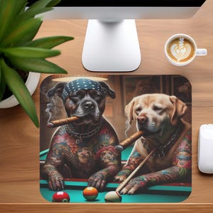 May include: A rectangular mousepad featuring a digital illustration of two dogs playing pool. One dog wears a bandana and smokes a cigar. Both dogs have tattoos and are positioned over a pool table with billiard balls.