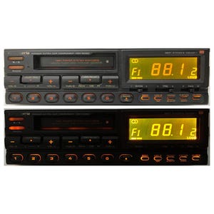 May include: Two vintage Pioneer car stereo head units. The top unit is off, the bottom unit is illuminated with orange lights. Both have a digital display showing "88.12" and various buttons for radio functions.