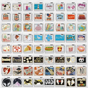 May include: A collection of silver-toned charm pendants with various designs and text. The charms feature images of food, musical instruments, patriotic symbols, and phrases like "Broadway Freak" and "I Love My Job."