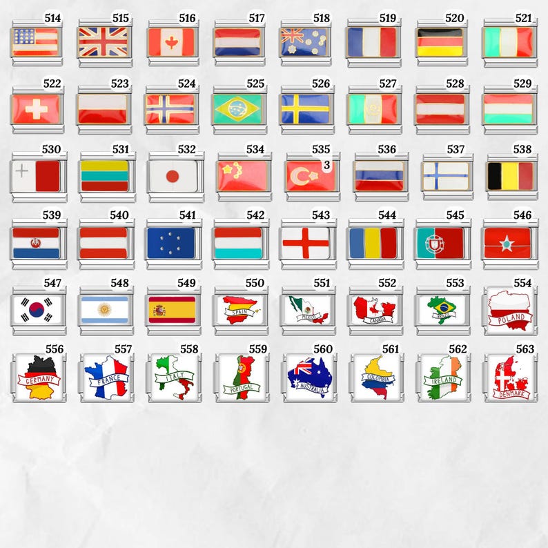 May include: A collection of rectangular charms featuring various national flags. Each charm has a silver border and a colorful enamel design representing a country's flag. The charms are numbered from 514 to 563.