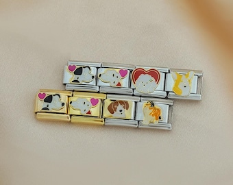Op de afbeelding: Honden-thema bedelarmbanden. Elke bedel toont een ander hondenras met kleurrijke emaille details. De bedels zijn gezet in goud- en zilverkleurig metaal, met hartaccenten. De armbanden worden gepresenteerd op een neutrale achtergrond.