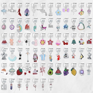 May include: A collection of silver-toned charm pendants with various designs, including a high-heeled shoe, a gun, a flower, a Christmas tree, and a house. Each charm is attached to a keyring. The charms are colorful and detailed.