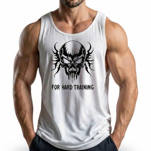 May include: White tank top with a black skull graphic and the text "FOR HARD TRAINING". The skull design features intricate details and a menacing expression. The tank top is sleeveless and made of a lightweight material.